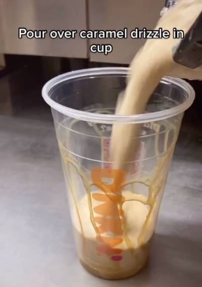 Pour caramel drizzle around cup