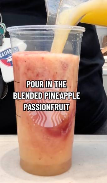 Pour blended pineapple passionfruit into cup