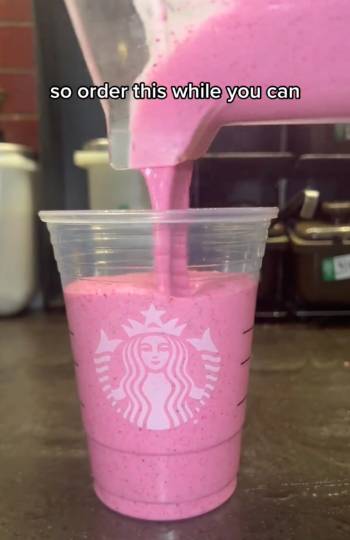 pour blended dragonfruit mixture into Starbucks plastic cup