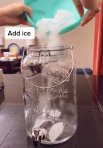 add ice into glass jar for hot pink barbie drink