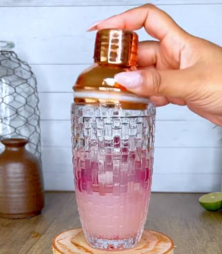 pour juice alcohol into glass shaker