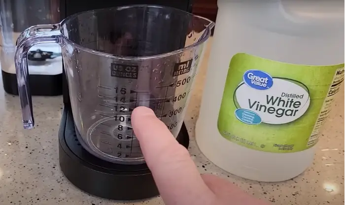 step2 fill measure cup 14 ounces white vinegar
