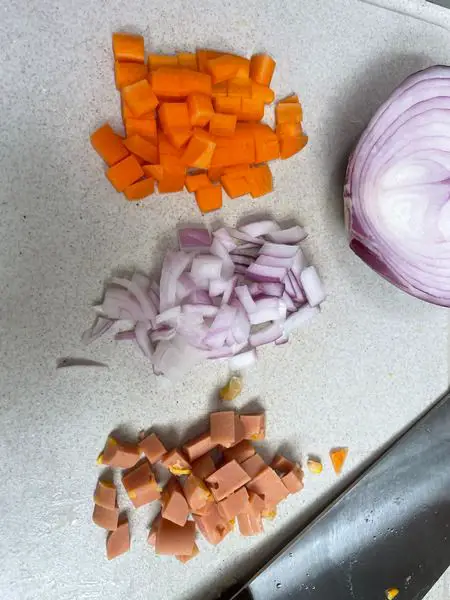 Step 1 Dice carrot onion sausage into small bits