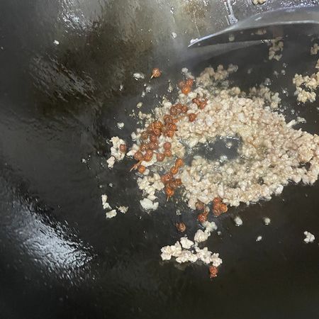 Step 2 Add Sichuan peppercorns and stir-fry