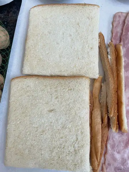 Step 4 Cut off three edges of each toast slice
